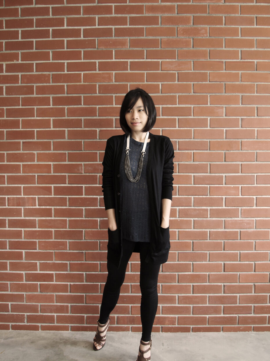 Ashes boutique owner Ashley Kwong shows us one of the cardigans she has on sale in the store