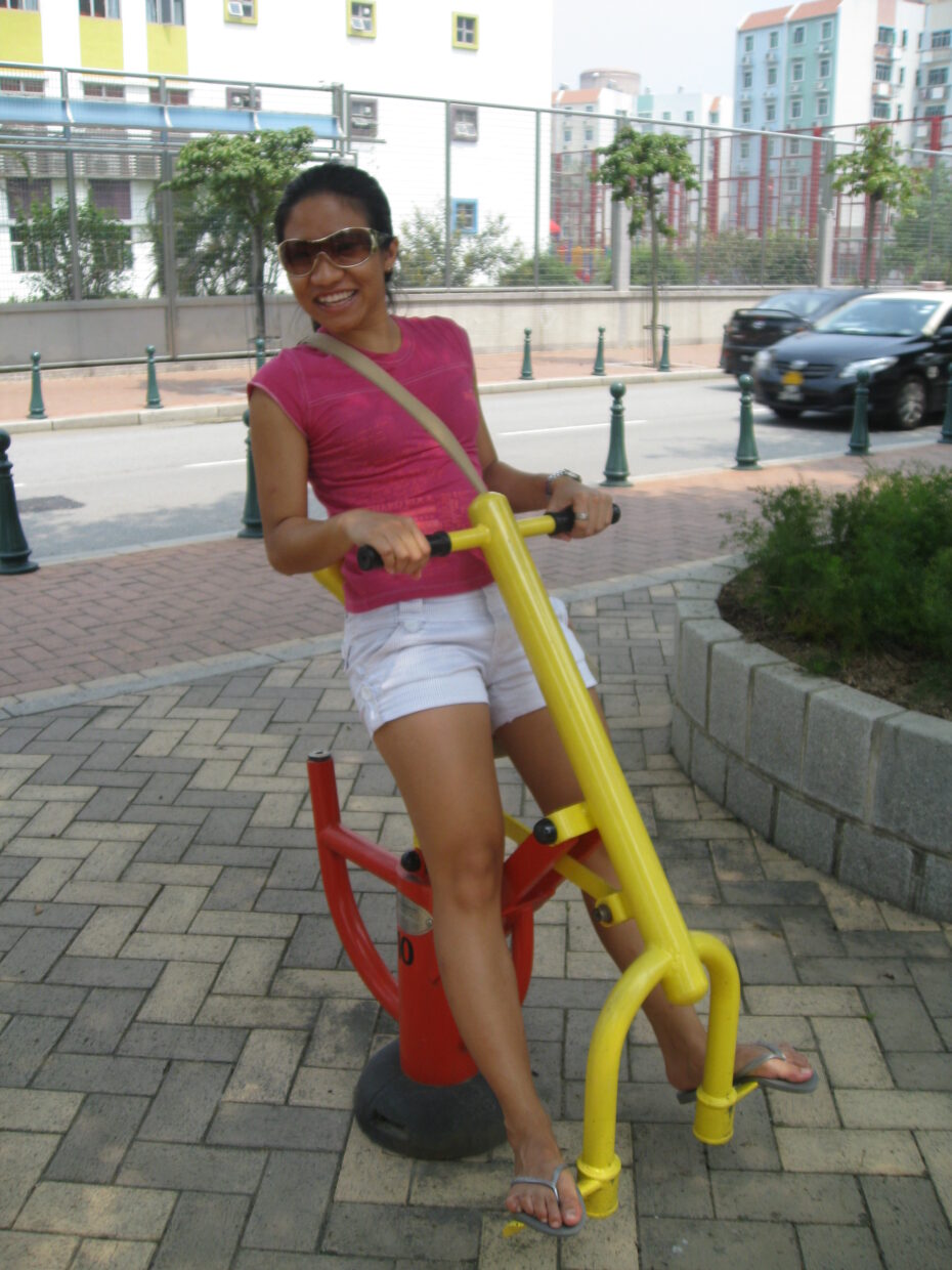 Carol testing out some random exercise equipment at the side of the road