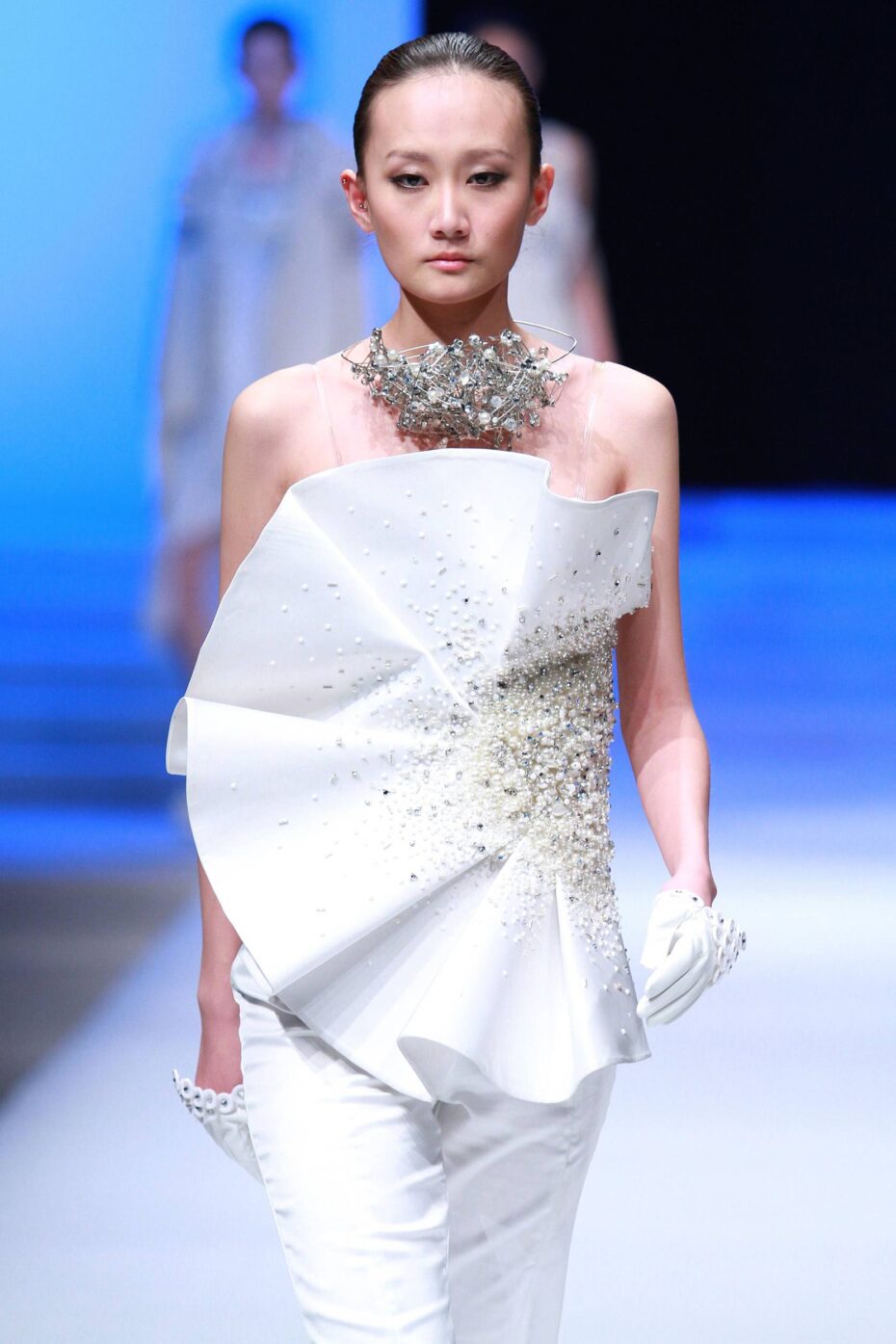 A model presents a Chinese designer's creation during the Cherry Cup New Fashion Designer Contest at the China Fashion Week in Beijing