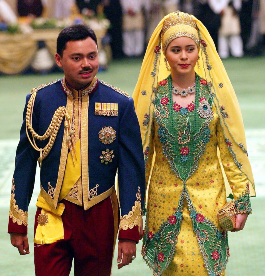Crown Prince Al-Muhtadee Billah Bolkiah, left, and his wife Princess Sarah Salleh arrive for their wedding banquet in Bandar Seri Begawan, Brunei, 2004.