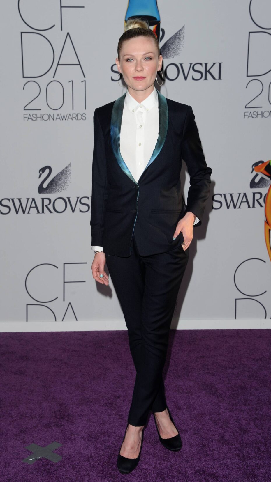 Kirsten Dunst in a black suit by Patrik Ervell