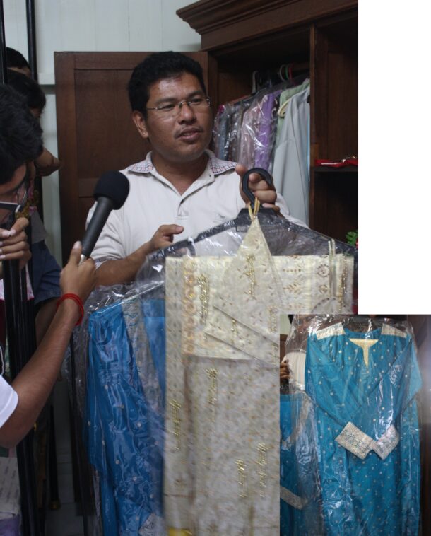 Chitty Living Gallery chairman K. Nadarajan showing Chittys traditional wedding garments.
