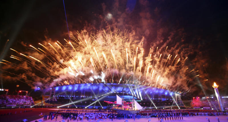opening Fireworks light up the sky as athletes and officials gather during opening ceremony the 26th Southeast Asian (SEA) Games at Jakabaring sport city in Palembang, South Sumatra, Indonesia, Friday, Nov 11, 2011