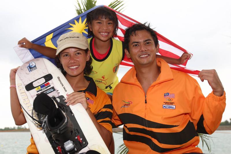 yoong Malaysia's Aaliyah Yoong celebrates with sister Phillipa Yoong and brother Alex Yong after winning the gold medal for the women's waterski tricks event in Jakabaring in Palembang, Nov 17 2011.
