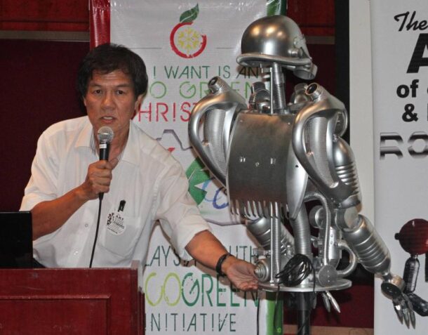 Robotics expert Lim Nam Aik with one of his creation made out of recycled items.
