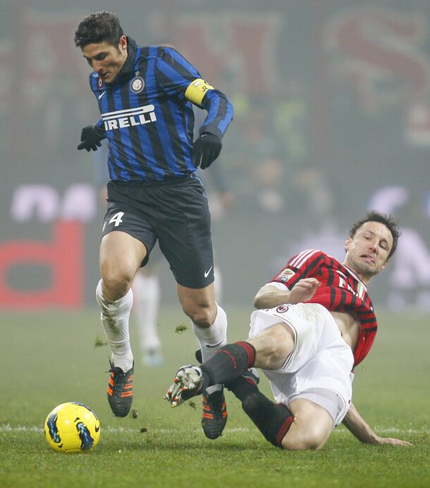Zanetti(left) and van Bommel were two of the 12 payers oer the age of 30 who played in the Milan derby