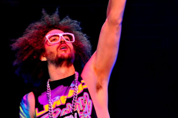 Redfoo (Stefan Kendal Gordy) putting his mic in the air while the crowds sing along to the music