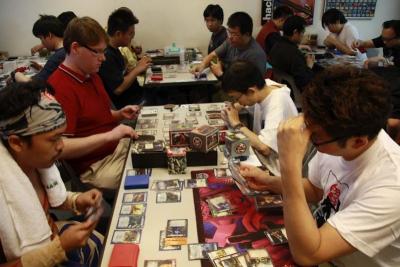 Trading Card gamers having their round of play