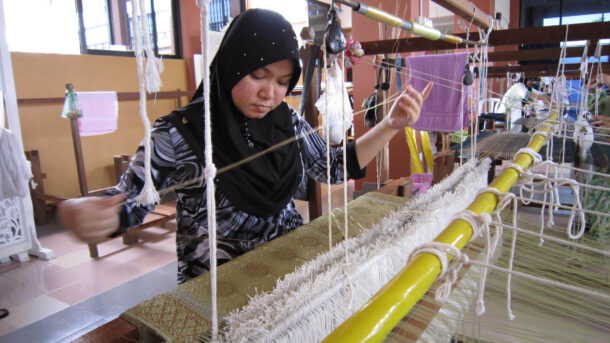 New Image3 A worker at the factory busy weaving a piece of songket.