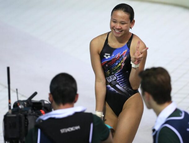 Malaysian diver Pandelela Rinong smiling to the live camera after competing in women's 10m platform prelimanary round at Aquatics Centre recently.