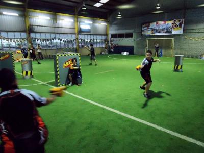 Participants of the NERF tournament in action during the finals.