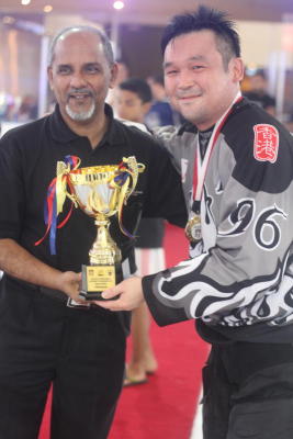 Hong Kong Hitmen captain Keith Fong receiving the Asian Division trophy.