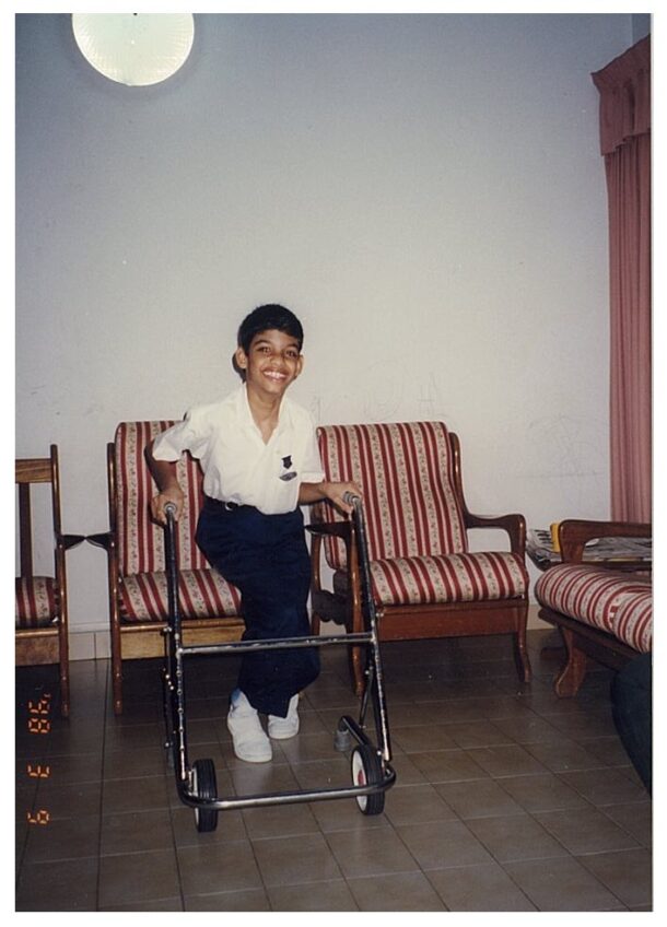 Hafiz standing up for quick moment to take a picture during his primary school days.