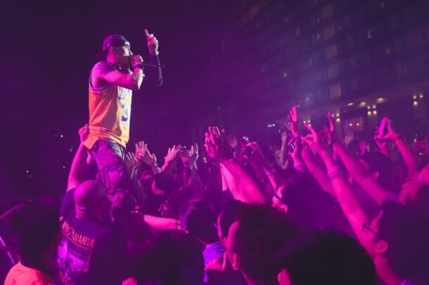 Loud cheers from the crowd as Taboo from Black Eyed Peas hits the stage.