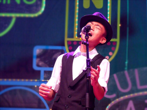 Ng Jun Shawn won the Solo Singing category with a rendition of Bruno Mars It Will Rain despite being just.