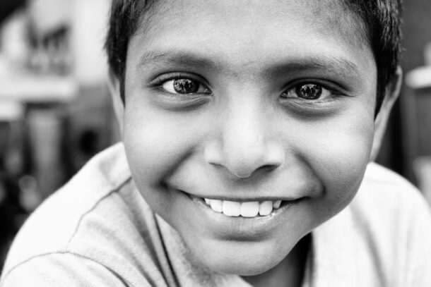 By muting the colours, one cannot help but focus on the boy's sparkly eyes.