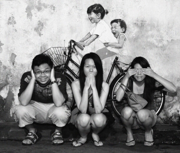 The lighting at the famous mural on Armenian Street is really bad at night, but converting the photo into a black and white image makes it work.