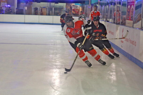 A HK Tiger and Singapore Manimal vying for the puck at the Malaysia International Ice Hockey Tournament in Sunway Pyramid.
