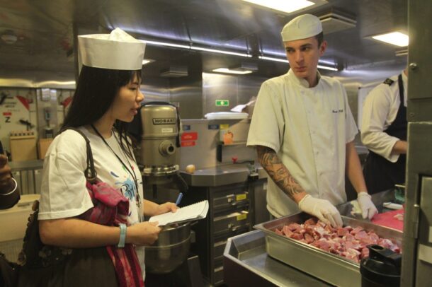BRAT Cassandra grilling one of the chefs on board HMS Daring on what the crew would have for lunch that day.