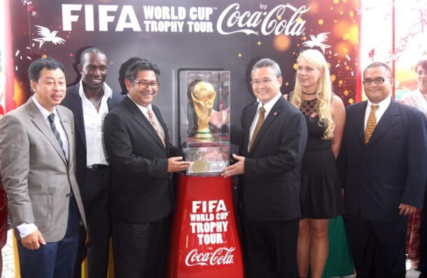 Football Association of Malaysia vice-president Datuk Seri Subahan Kamal (third from left) and Annamaria Gazda, the global football manager for Coca-Cola, showing off the FIFA World Cup trophy, which arrived from Hanoi accompanied by FIFA ambassador and former Manchester United star Dwight Yorke (second from left).