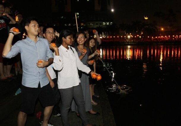 The sporting youths even took to writing down their Facebook URLs before tossing their oranges in