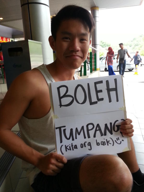 Marisha and Hoong held up signs written in the national language of the countries they travelled in (Malaysia, Thailand and Cambodia) to ask for rides.