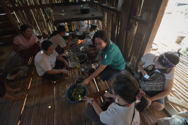 World Vision Malaysia staff sharing a meal with the people of Mae Sariang.