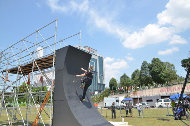 Up against it: The Warp Wall has proven to be a mammoth challenge as participants have to scale a curved wall in three or less attempts.