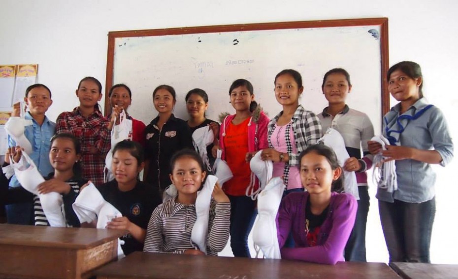 Young ladies in Siem Reap, Cambodia, happily receiving bras donated by the Uplift Project.