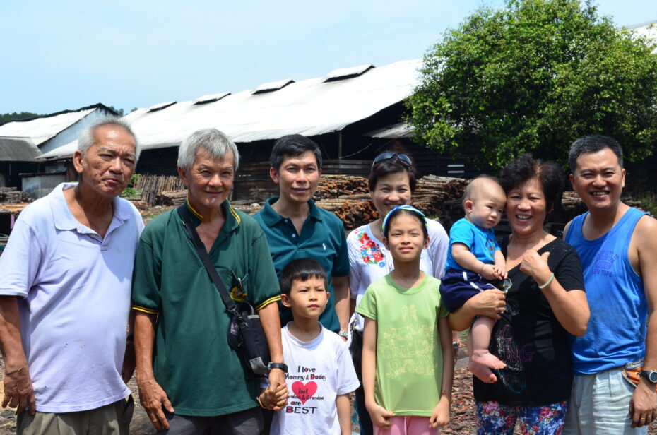Meet the Chuahs: Chuah Kee Yong, 43, (right) and (from left) his uncle Chuah Chow Aun, 67, and his father Chuah Cheow Seng, 70, pose with their family at the charcoal factory.