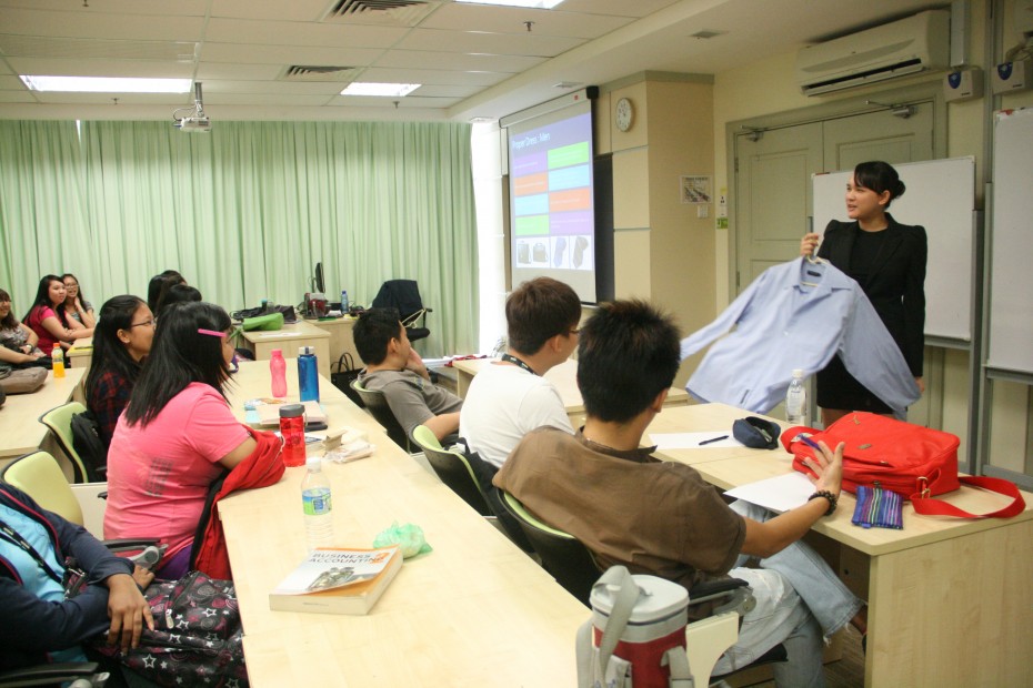 At her workshops, Hor Phooi Sim, 25, educates students on the appropriate dress code for a job interview.