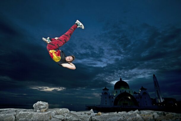 Click crazy: Geh often puts himself in the thick of the action to get the best shots. (above) This picture by Geh features world-class free runner Jason Paul in Malacca