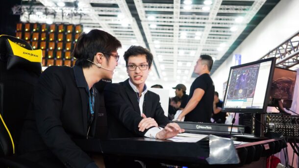 Looking forward: Shoutcasters Aaron ‘Panda’ Lim (left), 21, and Sean-Li ‘Lii’ Murmann, 19, hope one day the local e-sports scene will be able to sustain pro careers for shoutcasters. They are pictured here ‘casting’ at The Legends Circuit (TLC) final. – Photo by Ooi Tee Ping.
