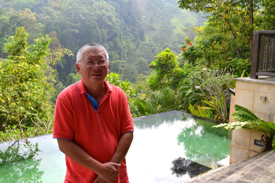 Felix Tee posing for a shot amidst his picturesque eco-villa.