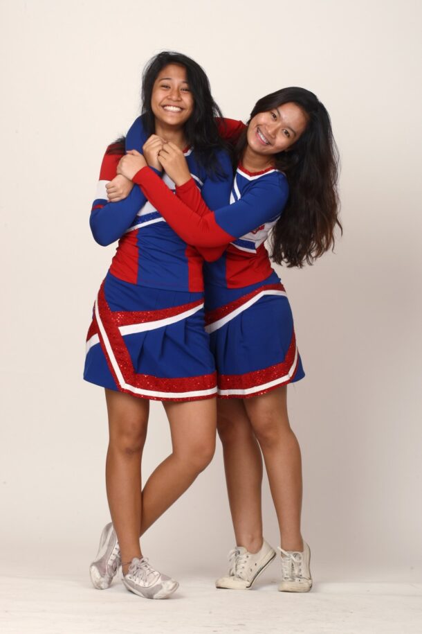 Nur Fatihah Abu Hassan (left) watched big sister Hidayah during cheer practice before falling in love with the sport herself - Photo: RAYMOND OOI/The Star
