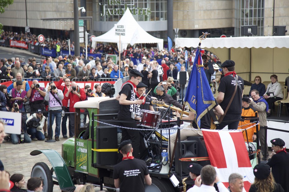 A funk band wearing berets on a vintage truck. Awesome.