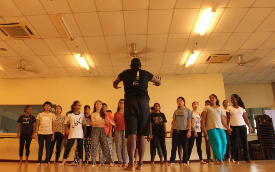 Choreographer Lex Lakshman demonstrates a dance move to the T4YP participants ahead of their final showcase. 