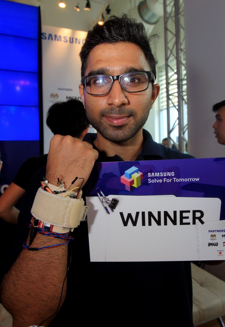 Mazlan developed a device that allows stroke survivors to play smartphone games that help with physiotherapy. ― Photos by: ART CHEN/The Star