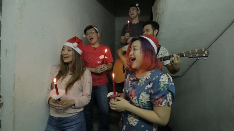 Singers Chelsia Ng (left) and Bihzhu (right) giving a surprise performance to a Christian Pakistani family seeking asylum in Malaysia.