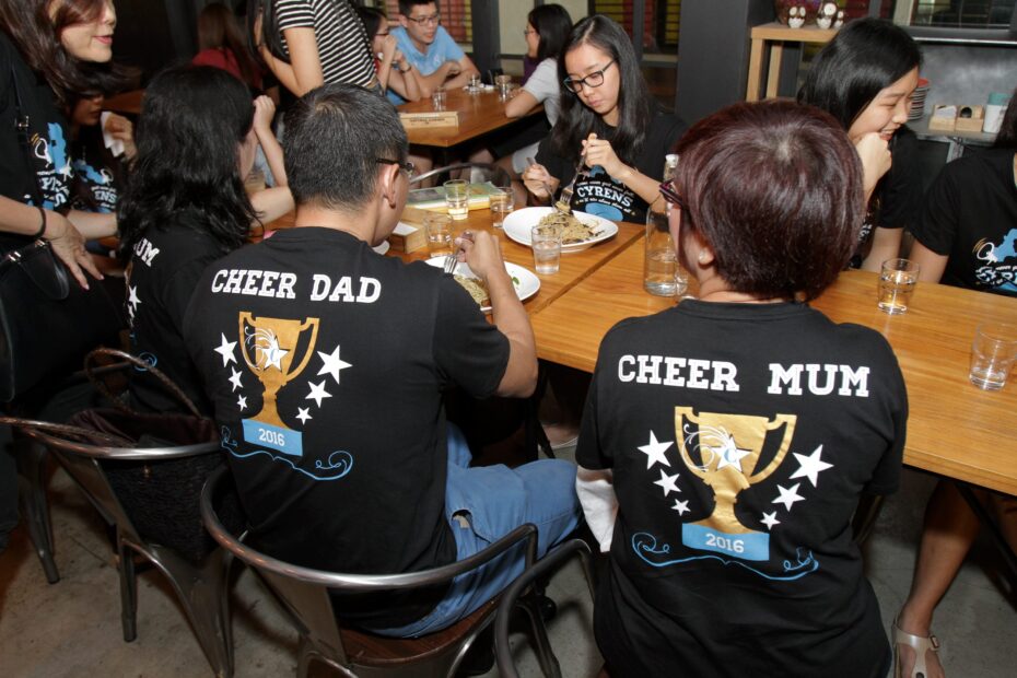 Even the parents of the girls have their own Cheer Mom and Cheer Dad T-shirts.