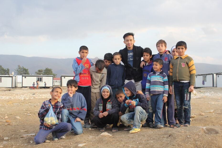 Lau with Syrian refugee children in Lebanon. He plans to cover the refugee crisis in Turkey in the near future.