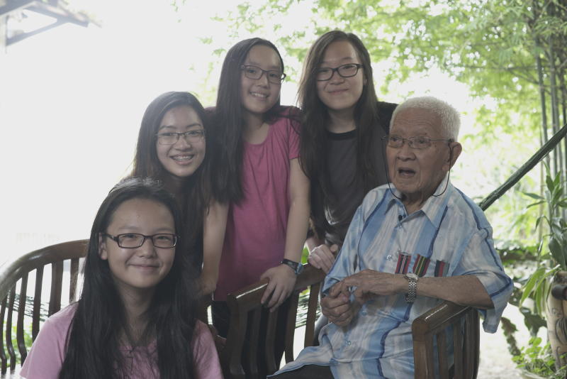 Lim (far right) with his granddaughters. Francine (second from left) praised his bravery and resilience, and said he was an inspiration to the whole family.