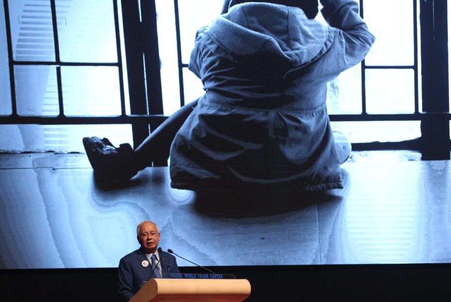 The Prime Minister announcing plans for a special child sexual crimes court, prompting a thunderous round of applause from the audience. — NORAFIFI EHSAN/The Star